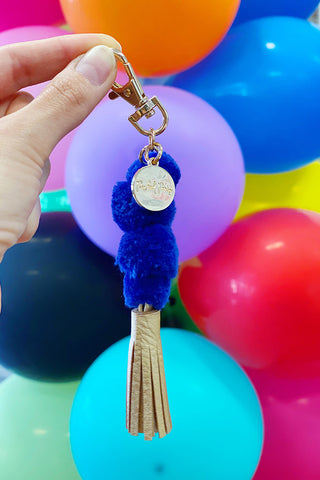 Get trendy with Pom Pom Keychain With Gold Tassel - Keychain available at ShopMucho. Grab yours for $7 today!